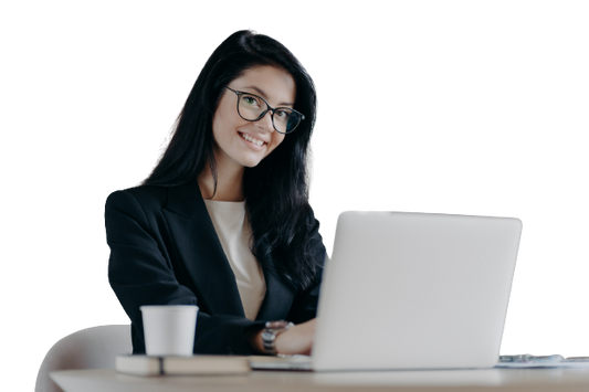 Happy worker with coffee at desk